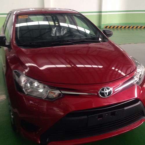 Meet the latest model of Toyota Vios. She looks like a sexy lady, pretty in red! For the rich only #toys for big #boys www.thriftylook.com #thriftylook #photography #iphoneography #cars #wheels #ride #pimpMyRide #hotWheels #toyota #vios #vehicles #engin