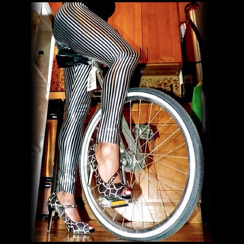 26 inches! Can you handle that? #heels #wheel #tire #sojes #shiny #satin #africanamerican #tights #female #beautiful #sexy #toes #feet #foot #bike #bicycle #onewheel